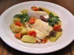 Halibut roasted with cherry tomatoes, potatoes and olives