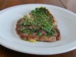 Grilled ribeye steak with an herb and EVOO sauce