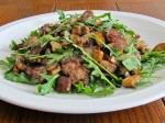 Tender sauteed steak "rags" and mushrooms atop arugula dressed with a pan sauce.
