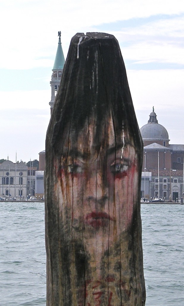 My girlfriend. A gondola post on the lagoon