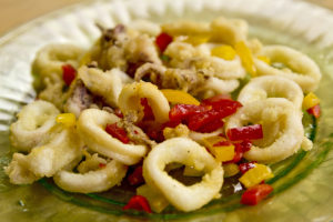 Crispy, tender fried calamari with spicy vinegar pepper confetti