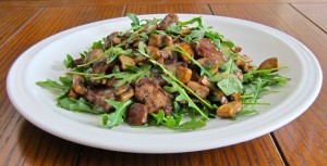 Tender sauteed steak "rags" and mushrooms atop arugula dressed with a pan sauce.