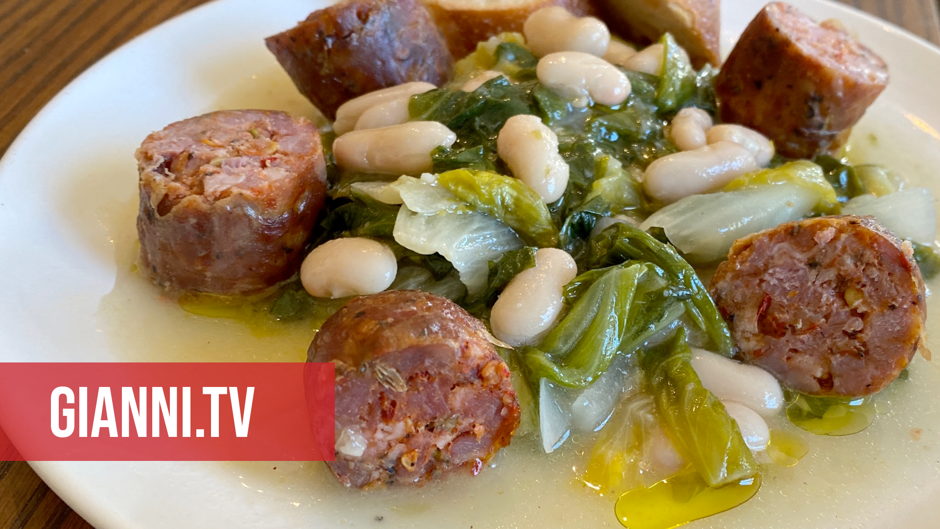 A plate with escarole, beans & sausage