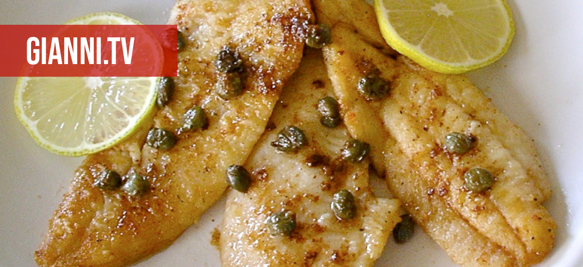 Petrales sole on a white dish with lemon slices